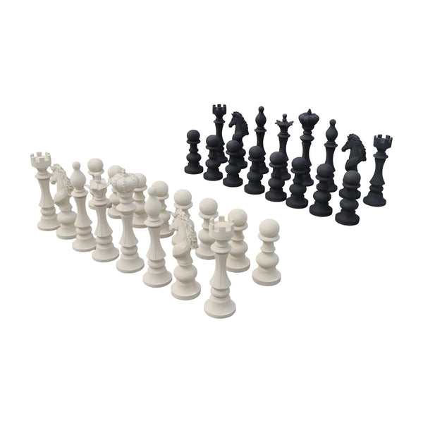 Decorative set of black and white chess pieces featuring traditional shapes like kings, queens, and knights.