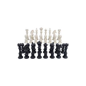 Decorative set of black and white chess pieces featuring traditional shapes like kings, queens, and knights.