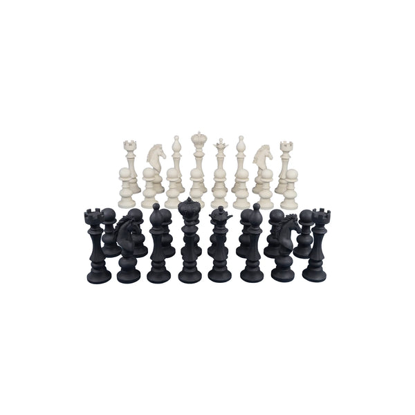 Decorative set of black and white chess pieces featuring traditional shapes like kings, queens, and knights.