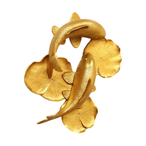 Decorative gold sculpture featuring two koi fish swimming among textured lily pads.