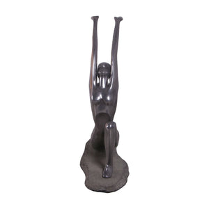 Decorative abstract sculpture of a figure in a yoga lunge pose with a smooth dark finish.