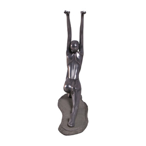 Decorative abstract sculpture of a figure in a yoga lunge pose with a smooth dark finish.