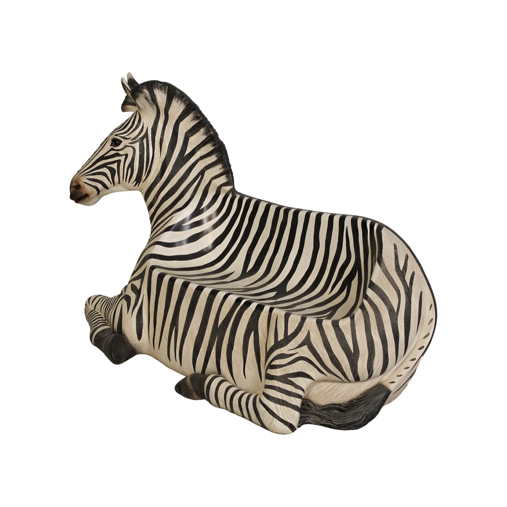 Decorative chair designed to look like a resting zebra with black and white stripes and an integrated seat.