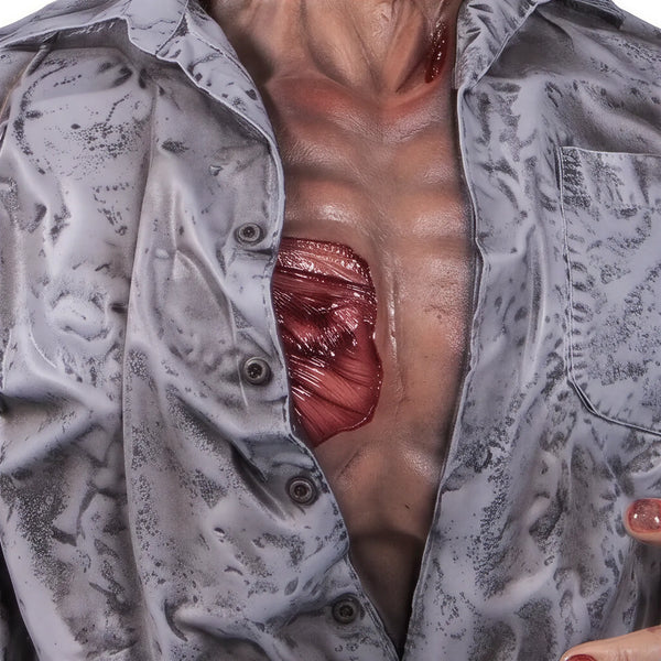 Half-body decorative zombie statue with weathered grey shirt, pale skin, and blood details.