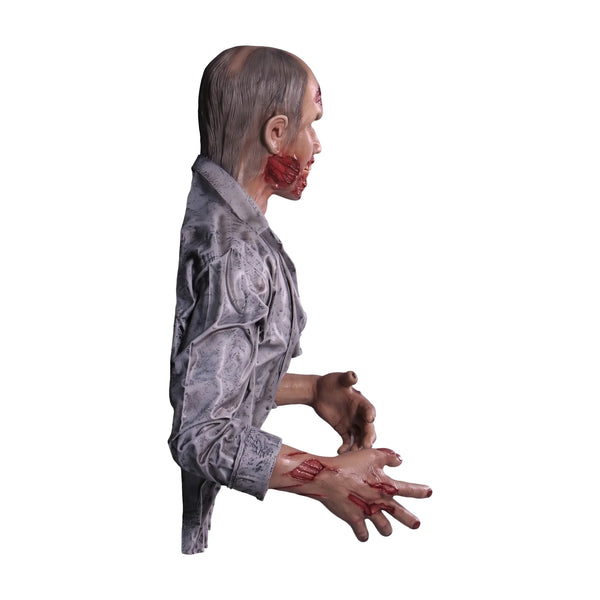 Half-body decorative zombie statue with weathered grey shirt, pale skin, and blood details.